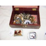 A box of costume jewellery including bangles and b