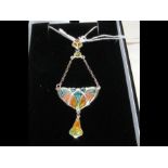 A silver and enamel pendant on chain