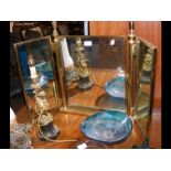 A modern brass triple dressing table mirror