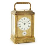 A LATE 19TH CENTURY FRENCH ENGRAVED GILT BRASS GORGE CASE REPEATING CARRIAGE CLOCK