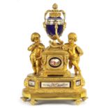 A FINE MID 19TH FRENCH ORMOLU AND 'SEVRES' PORCELAIN MOUNTED REVOLVING URN CLOCK