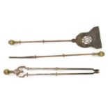 A SET OF THREE LATE GEORGIAN BRASS AND STEEL FIRE IRONS