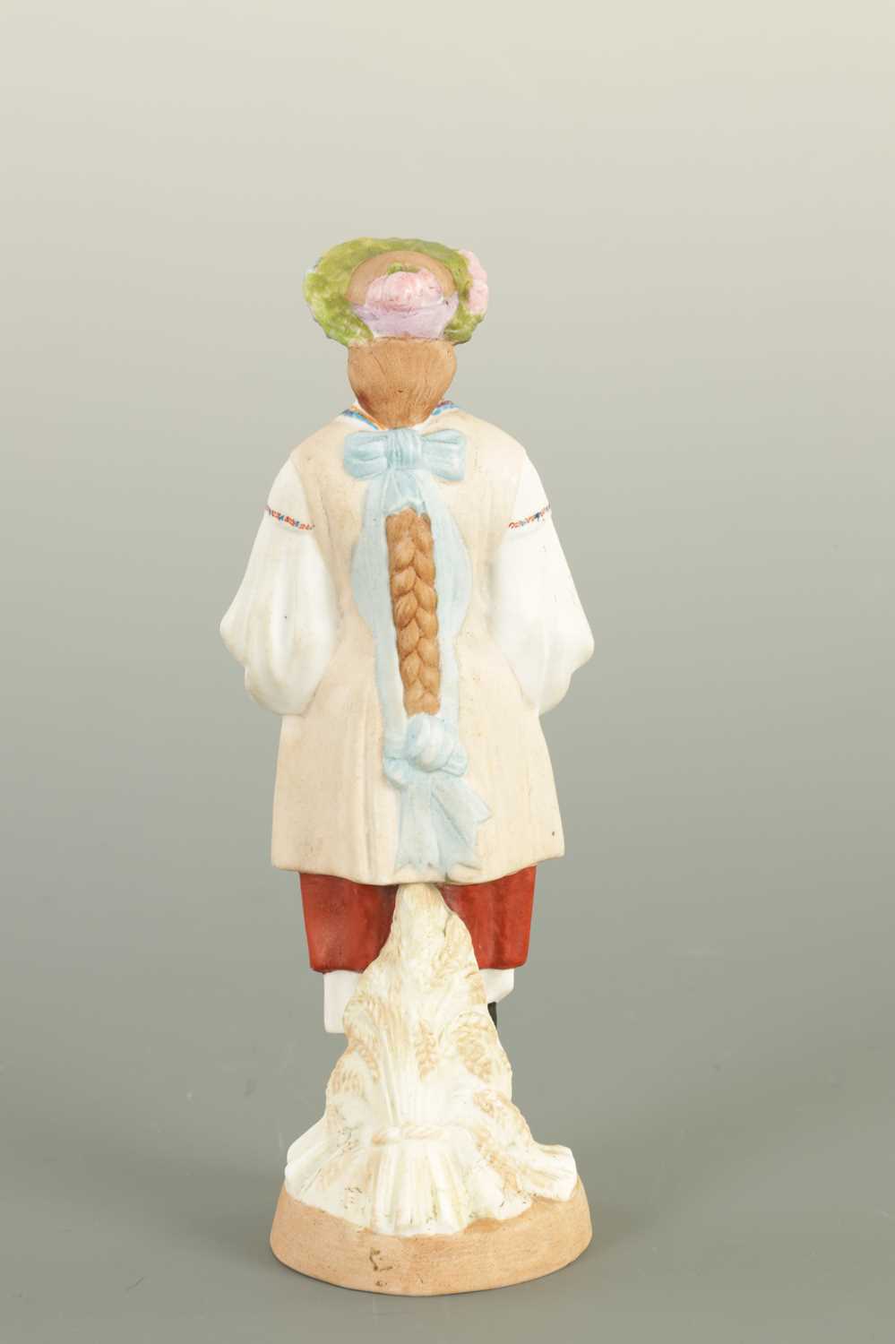 AN EARLY 20TH CENTURY RUSSIAN STANDING BISQUE FIGURE OF A FLOWER GIRL - Image 3 of 11