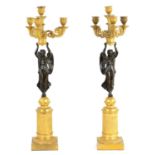 A FINE PAIR OF 19TH CENTURY REGENCY ORMOLU AND PATINATED BRONZE CANDELABRA IN THE NEO CLASSICAL STYL