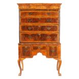 AN EARLY 18TH CENTURY FIGURED WALNUT AND ASH CROSSBANDED CHEST ON STAND