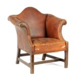 AN EARLY GEORGE III BRASS STUDDED BROWN LEATHER UPHOLSTERED MAHOGANY LIBRARY CHAIR