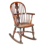 A 19TH CENTURY CHILD'S YEW-WOOD WINDSOR CHAIR