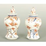 A PAIR OF 18TH/19TH CENTURY CHINESE PORCELAIN LIDDED VASES
