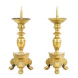 A PAIR OF 17TH/18TH CENTURY CONTINENTAL CAST BRASS PRICKET CANDLESTICKS