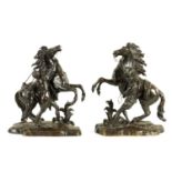 A LARGE PAIR OF 19TH CENTURY PATINATED BRONZE MARLEY HORSES