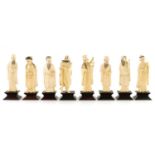A COMPLETE SET OF EIGHT MEIJI PERIOD JAPANESE IVORY CARVED OKIMONOS