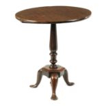AN EARLY 18TH CENTURY PRIMITIVE WALNUT TILT TOP OCCASIONAL TABLE