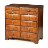 AN UNUSUAL EARLY 18TH CENTURY FIGURED WALNUT BACHELORS CHEST