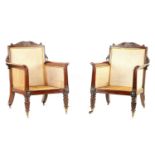 A FINE PAIR OF REGENCY BERGERE LIBRARY CHAIRS IN THE MANNER OF GILLOWS