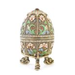 A FINE EARLY 20TH CENTURY RUSSIAN RAISED ENAMEL WORK ON SILVER EGG WITH GILT INTERIOR
