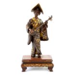 A FINE QUALITY JAPANESE MEIJI PERIOD PATINATED BRONZE AND GILT SCULPTURE OF A FEMALE MUSICIAN BY MIY