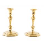 A PAIR OF MID 18TH CENTURY CAST BRASS CANDLESTICKS