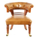 A WILLIAM IV SATINWOOD AND LEATHER UPHOLSTERED LIBRARY ARMCHAIR