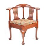 A GEORGE II MAHOGANY CORNER CHAIR