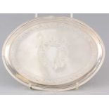 A GEORGE III OVAL BRIGHT CUT ENGRAVED SILVER TEAPOT STAND
