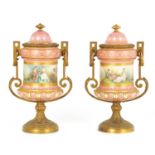 A PAIR OF 19TH CENTURY SEVRES PORCELAIN AND ORMOLU MOUNTED LIDED VASES
