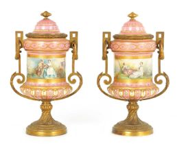 A PAIR OF 19TH CENTURY SEVRES PORCELAIN AND ORMOLU MOUNTED LIDED VASES