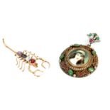 TWO LADIES GOLD AND SILVER GEM SET BROOCHES