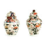 A PAIR OF 18TH CENTURY CHINESE IMARI JARS AND COVERS