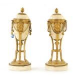 A PAIR OF 19TH CENTURY ADAM STYLE WHITE MARBLE AND ORMOLU MOUNTED REVERSIBLE URNS/CANDLESTICKS