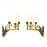 A PAIR OF EARLY 20TH CENTURY REGENCY STYLE BRONZE AND ORMOLU WALL LIGHTS