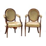 A PAIR OF 19TH CENTURY HEPPLEWHITE STYLE UPHOLSTERED ARMCHAIRS