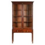 A MID 18TH CENTURY MAHOGANY CABINET ON STAND