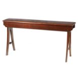 AN ARTS AND CRAFTS MAHOGANY BENCH IN THE MANNER OF JAS. SHOOLBRED