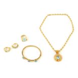 AN 18CT GOLD AND AQUAMARINE FOUR PIECE SUITE OF EVENING JEWELLERY