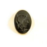 A 19TH CENTURY 9CT GOLD AND BLACK ONYX INTAGLIO SIGNET RING