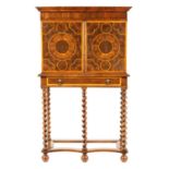 A WILLIAM AND MARY LABURNUM OYSTER VENEERED CABINET ON STAND OF SMALL SIZE
