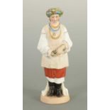 AN EARLY 20TH CENTURY RUSSIAN STANDING BISQUE FIGURE OF A FLOWER GIRL