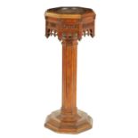 A 19TH CENTURY OAK GOTHIC STYLE CARVED FONT