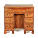 A GEORGE III MAHOGANY KNEEHOLE DESK