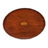 A GEORGE III FIGURED MAHOGANY OVAL TRAY