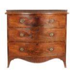 A GEORGE III HEPPLEWHITE DESIGN FIGURED MAHOGANY SERPENTINE CHEST