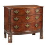 AN UNUSUAL GEORGE III AND LATER MAHOGANY CHIPPENDALE DESIGN COMMODE OF SERPENTINE OUTLINE