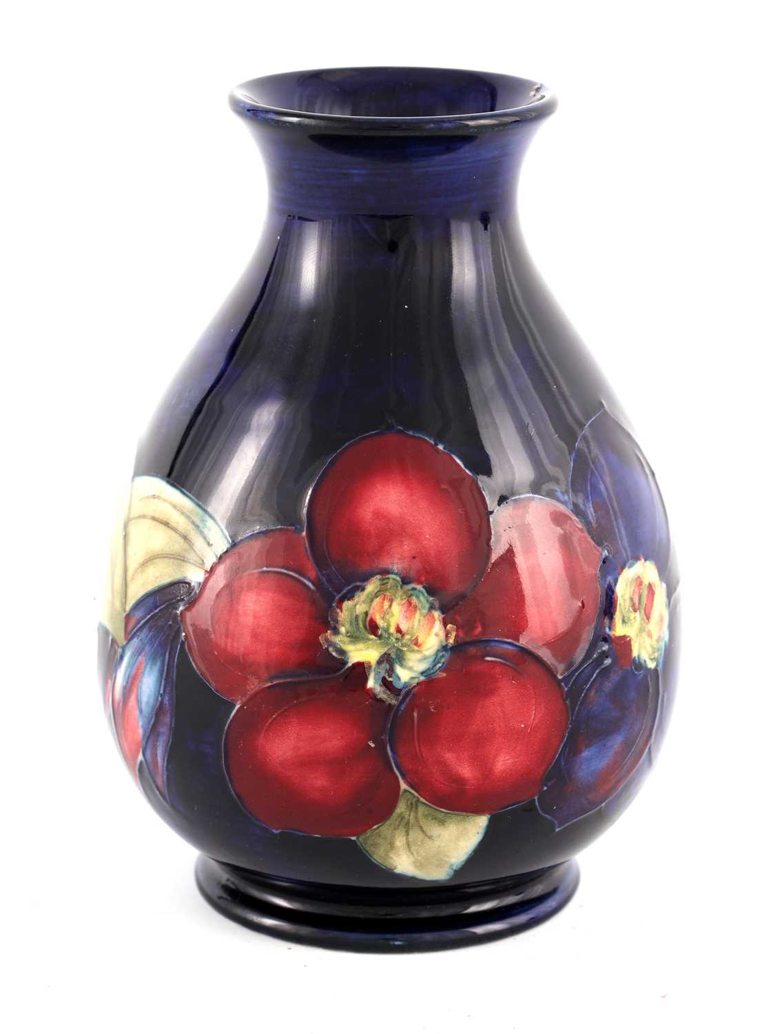 A WALTER MOORCROFT SMALL BULBOUS FOOTED VASE