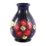 A WALTER MOORCROFT SMALL BULBOUS FOOTED VASE