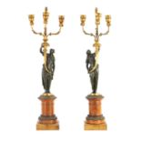 A FINE PAIR OF EARLY 19TH CENTURY FRENCH EMPIRE CAST BRONZE, ORMOLU AND OAK MOUNTED CANDELABRA