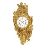 A 19TH CENTURY FRENCH GILT BRASS ROCOCO CARTEL CLOCK