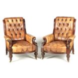 A PAIR OF 19TH CENTURY LEATHER BUTTON BACKED UPHOLSTERED ARMCHAIRS