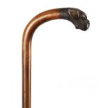 A 19TH CENTURY CROOK HANDLED WALKING STICK WITH CARVED BULLDOG HEAD HANDLE