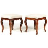 A PAIR OF 18TH CENTURY WALNUT STOOLS