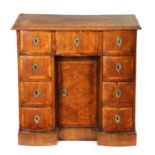 AN 18TH CENTURY CONTINENTAL WALNUT AND KINGWOOD CROSSBANDED KNEEHOLE DESK